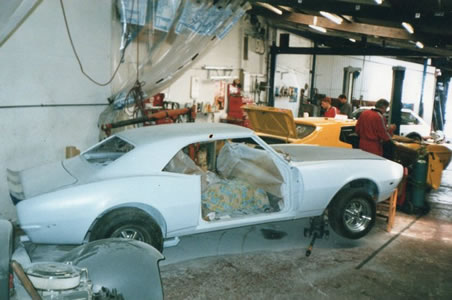Camaro & Ford Mustang in the workshop